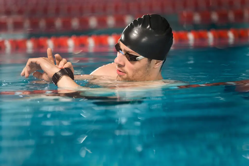 male-swimmer-checking-his-watch.jpg